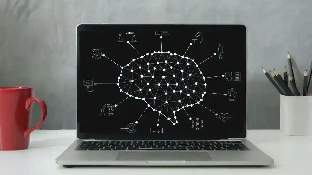 Laptop screen with a diagram of AI and the industries it impacts.
